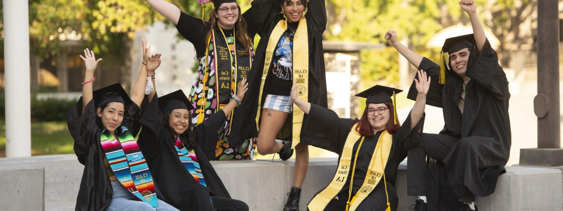 students celebrating graduation